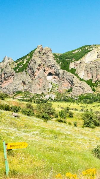 Packed backpack and hiking boots at a hostel